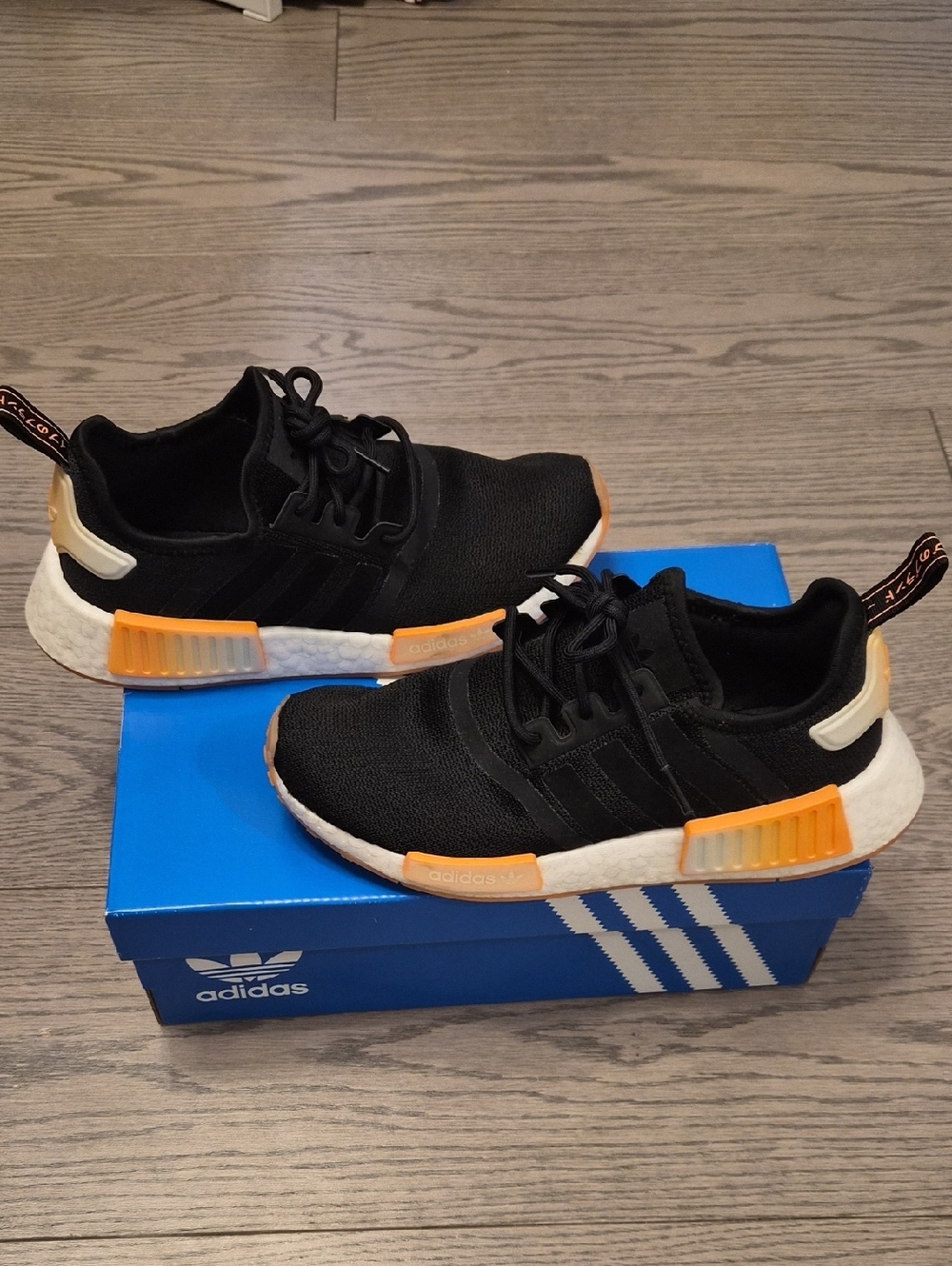 adidas woman NMD R1 Black with Orange Highlights. Size 7